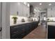 Sleek kitchen features quartz counters, stainless appliances, subway tile backsplash, and custom cabinets at 306 White Magnolia Ln, Fuquay Varina, NC 27526