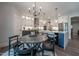 Spacious open Kitchen with seating at large island, with lots of white cabinets and modern appliances at 306 White Magnolia Ln, Fuquay Varina, NC 27526