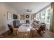 Stylish Living Room with a Fireplace, built-in shelving and abundant natural light at 306 White Magnolia Ln, Fuquay Varina, NC 27526