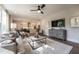 Cozy living room featuring modern decor, an open layout, and seamless connectivity to the dining area and kitchen at 306 White Magnolia Ln, Fuquay Varina, NC 27526