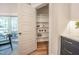 Walk-in Pantry shows shelving and organization next to a view of screened in porch at 306 White Magnolia Ln, Fuquay Varina, NC 27526