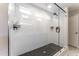 This glass-enclosed shower features a rainfall shower head and patterned tile at 306 White Magnolia Ln, Fuquay Varina, NC 27526