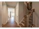 Elegant wooden staircase with iron railings, leading to the upper level of the home at 306 White Magnolia Ln, Fuquay Varina, NC 27526