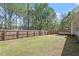 Spacious, fenced backyard offering a deck, and ample room to enjoy at 310 Cedarhurst Ln, Franklinton, NC 27525