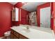 Bright bathroom featuring a large mirror, vanity with sink, and shower/tub combination for relaxation at 310 Cedarhurst Ln, Franklinton, NC 27525