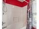 Bright bathroom featuring a shower-tub combo with decorative shower curtain at 310 Cedarhurst Ln, Franklinton, NC 27525