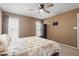 This bedroom features carpet, neutral walls, and a ceiling fan at 310 Cedarhurst Ln, Franklinton, NC 27525