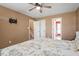 This bedroom features carpet, neutral walls, and a ceiling fan at 310 Cedarhurst Ln, Franklinton, NC 27525