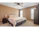 This bedroom features carpet, neutral walls, and a decorative ceiling fan at 310 Cedarhurst Ln, Franklinton, NC 27525