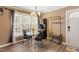 Cozy dining area featuring a glass table, four chairs, and a hall tree to keep coats and keys organized at 310 Cedarhurst Ln, Franklinton, NC 27525