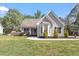 Charming single-Gathering home with well-manicured lawn and bay window at 310 Cedarhurst Ln, Franklinton, NC 27525