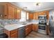 Well-equipped kitchen featuring modern appliances, ample cabinet space, and stylish backsplash for cooking convenience at 310 Cedarhurst Ln, Franklinton, NC 27525
