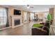 Inviting living room with fireplace, laminate floors, and lots of natural light at 310 Cedarhurst Ln, Franklinton, NC 27525