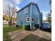 Back view of a two-story blue home with backyard and parking space at 3109 Cinnamon Circle Cir, Raleigh, NC 27610