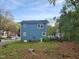 Back view of a two-story blue home with backyard and green lawn at 3109 Cinnamon Circle Cir, Raleigh, NC 27610