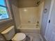 A bright, clean bathroom featuring tile flooring, modern fixtures, and a bathtub at 3109 Cinnamon Circle Cir, Raleigh, NC 27610