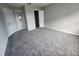 An inviting room featuring neutral walls, new carpeting, and ample natural light at 3109 Cinnamon Circle Cir, Raleigh, NC 27610