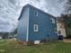 Side view of a two-story blue home with lush green lawn at 3109 Cinnamon Circle Cir, Raleigh, NC 27610