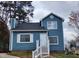 Charming two-story home with white trim, light blue siding, and landscaped front yard at 3109 Cinnamon Circle Cir, Raleigh, NC 27610