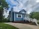 Charming two-story home with light blue siding and landscaped front yard at 3109 Cinnamon Circle Cir, Raleigh, NC 27610