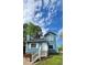 Charming two-story blue home with landscaped front yard and white picket fence at 3109 Cinnamon Circle Cir, Raleigh, NC 27610