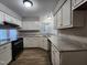 Updated kitchen with stainless steel appliances, granite countertops, and hardwood flooring at 3109 Cinnamon Circle Cir, Raleigh, NC 27610