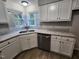 Kitchen with stainless steel appliances, granite countertops, and white cabinets at 3109 Cinnamon Circle Cir, Raleigh, NC 27610