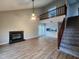 Spacious living room with a fireplace, a loft area, and hardwood floors at 3109 Cinnamon Circle Cir, Raleigh, NC 27610