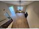 Top down view of a bright living room with vaulted ceiling, fireplace, wood floors and staircase at 3109 Cinnamon Circle Cir, Raleigh, NC 27610