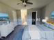 Staged main bedroom featuring a ceiling fan, ensuite bathroom, and closet at 3109 Cinnamon Circle Cir, Raleigh, NC 27610