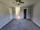 Main bedroom with ceiling fan, ensuite bathroom, and closet at 3109 Cinnamon Circle Cir, Raleigh, NC 27610
