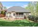 Spacious backyard with a well-maintained lawn, deck and screened porch at 317 Okamato St, Raleigh, NC 27603
