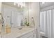 Bright bathroom features a solid surface vanity and a shower with a curtain at 317 Okamato St, Raleigh, NC 27603