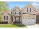Charming two-story home with a welcoming front porch and manicured landscaping at 317 Okamato St, Raleigh, NC 27603