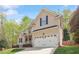 Charming two-story home with a welcoming front porch and a two car garage at 317 Okamato St, Raleigh, NC 27603