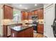 Kitchen features stainless steel appliances, granite countertops, and modern lighting at 317 Okamato St, Raleigh, NC 27603