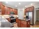 Kitchen featuring stainless steel appliances, granite countertops, and a central island at 317 Okamato St, Raleigh, NC 27603