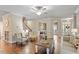 Open living space with hardwood floors, staircase, and lots of natural light at 317 Okamato St, Raleigh, NC 27603