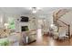Comfortable living room showcasing a fireplace, stylish seating, and backyard views at 317 Okamato St, Raleigh, NC 27603