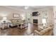 Cozy living room with a fireplace, comfortable seating, and lots of natural light at 317 Okamato St, Raleigh, NC 27603