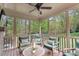 Relaxing screened porch with comfortable seating and a serene view at 317 Okamato St, Raleigh, NC 27603