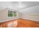 Bright bedroom with hardwood floors and a large window, offering ample natural light at 323 Coral Ave, Goldston, NC 27252