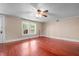 Bedroom with hardwood floors, natural light from the windows, and neutral wall paint at 323 Coral Ave, Goldston, NC 27252