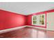 Bedroom showcasing hardwood floors and two windows at 323 Coral Ave, Goldston, NC 27252