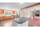 Spacious kitchen featuring a granite island, stainless steel appliances, and wooden cabinetry at 323 Coral Ave, Goldston, NC 27252