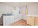 Functional laundry room with modern appliances and ample storage space at 323 Coral Ave, Goldston, NC 27252