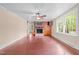 Bright living room featuring a brick fireplace, built-in shelving, and hardwood floors at 323 Coral Ave, Goldston, NC 27252