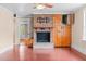 Living room showcasing brick fireplace and built-in cabinets, perfect for storage at 323 Coral Ave, Goldston, NC 27252