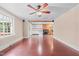 Open floor plan leading to the kitchen, highlighting the home's flow and hardwood flooring at 323 Coral Ave, Goldston, NC 27252