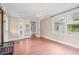 Bright living room featuring hardwood floors, a decorative chandelier, and glass doors leading to other rooms at 323 Coral Ave, Goldston, NC 27252